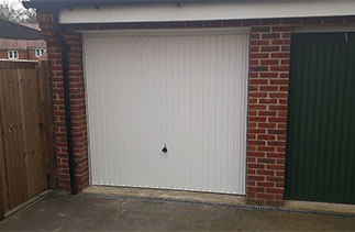 A Garador Carlton style steel up and over garage door with a steel frame. Fitted in Bagshot, Surrey.