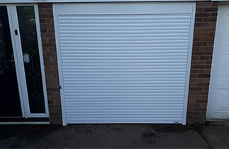 A Gliderol 55mm Compact insulated roller shutter garage door. Fitted in Camberley, Surrey.