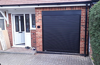 A Gliderol 55mm Compact insulated roller shutter garage door. Fitted in Laleham, Surrey.