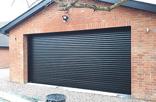 A Sws Seceuroglide Excel insulated roller shutter garage door. Fitted in Wargrave, Berkshire.