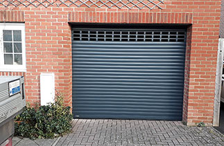 A Sws Seceuroglide Excel insulated roller shutter garage door, with vented windows. Fitted near Basingstoke, Hampshire.