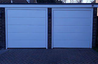 Two Garador Ascot style steel up and over garage doors with steel frames. Fitted in Camberley, Surrey.