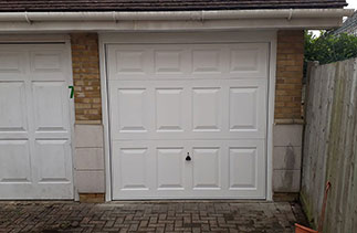 A Garador steel range up and over garage door. In the Beaumont style in White with a White steel frame. Fitted in Deepcut, Surrey.