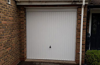 A Garador steel range up and over garage door in the Carlton style. In White with a White steel frame. Fitted in Sandhurst. Berkshire.
