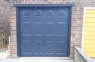 A Garador steel range up and over garage door in the Cathedral style. In Anthracite Grey with a Anthracite Grey steel frame. Fitted near Aldershot. Hampshire.
