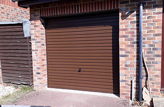 A Garador steel range up and over garage door in the Horizon style. In Brown with a Brown  steel frame. Fitted in Farnborough. Hampshire.