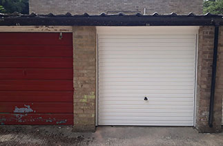 A Garador steel range up and over garage door in the Horizon style. With a White steel frame. Fitted in Fleet. Hampshire.