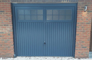 A Garador steel range up and over garage door. In the Salisbury style. In Slate Grey with a matching steel frame. Fitted in Herriard. Near Basingstoke. Hampshire.