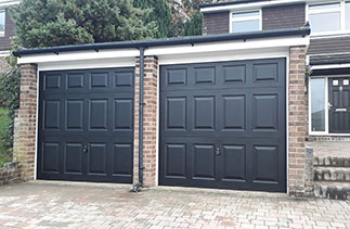 Two Garador steel range up and over garage doors. In the Beaumont style, in Black With White steel frames. Fitted in Ascot. Berkshire.