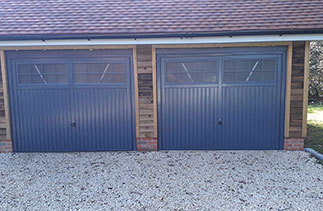 Two Garador steel range up and over garage doors. In the Salisbury style, in Slate Grey. With matching steel frames and with Four point locking. Fitted in Herriard. Near Basingstoke. Hampshire.