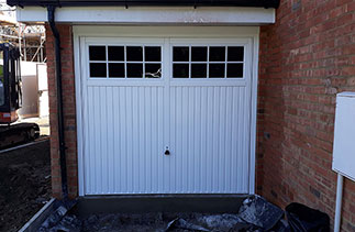 A Garador Salisbury style white steel up and over garage door. Fitted in Dorking, Surrey.