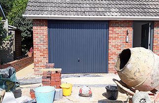 A Garador Steel up and over garage door. In the Carlton style, in Anthracite Grey, With a matching steel frame. Fitted in Camberley. Surrey