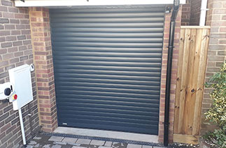 A Sws Seceuroglide Excel Insulated Roller Shutter Garage Door in Anthracite Grey. Fitted in Lightwater Surrey.