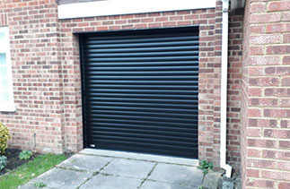 A Sws Seceuroglide Excel Insulated Roller Shutter Garage Door in Black. Fitted in Farnborough, Hampshire
