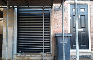 A Sws Seceuroglide Excel Insulated Roller Shutter Garage Door in Black. Fitted in New Haw, Surrey.