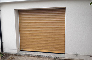 A Sws Seceuroglide Excel Insulated Roller Shutter Garage Door in Painted Finish Natural Oak. Fitted in Cippenham, Slough, Berkshire