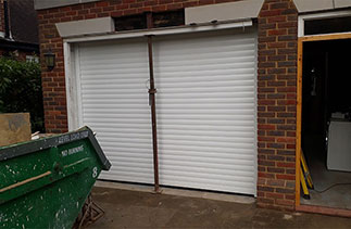 A Sws Seceuroglide Excel Insulated Roller Shutter Garage Door in White. Fitted in Virginia Water, Surrey