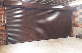 The inside view of the Painted Walnut Seceuroglide Excel Roller Shutter Garage Door. Fitted in Windlesham, Surrey