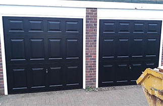 Two Garador Beaumont Style steel up and over garage doors in Black with White steel frames. Fitted in Walton On Thames, Surrey.