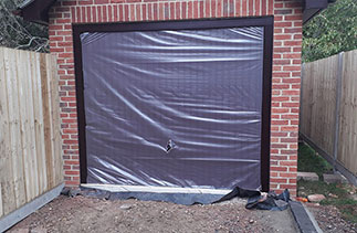 A Garador steel range up and over garage door in the Carlton style. In Burgundy Brown with a matching steel  frame. With Rosewood pvc. Fitted in Basingstoke. Hampshire.