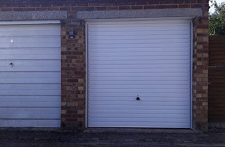 A Garador steel range up and over garage door in the Horizon style. In White with a White steel frame. Fitted in Sandhurst. Berkshire.