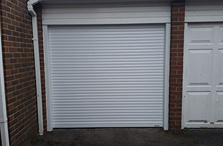 A Gliderol 55mm compact roller shutter garage door. In White with matching guides and a matching full box. Fitted in Fleet. Hampshire.