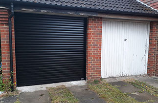A Gliderol 77mm insulated Roller shutter garage door. In Black with matching guides and a matching full. Fitted in Farnborough. Hampshire.