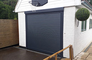 A Sws Seceuroglide compact roller shutter garage door. In Anthracite Grey with matching guides and a matching full box. Fitted in Finchampstead. Berkshire.