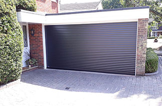 A Sws Seceuroglide Excel roller shutter garage door. In Graphite. With White guides and a white full box. Fitted in Liss. Hampshire.