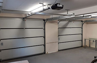 Inside view of Two single width Carteck 40mm insulated sectional garage doors. With Carteck 280 Belt driven electronic operators.