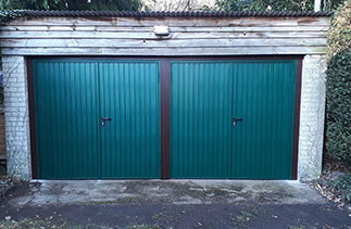 The after picture of the completed installation. The timber frame work was stained in Black and then has Mahogany pvc on the front face of the timber frame and steel frames the doors are supplied with. Job was in Bordon. Hampshire.