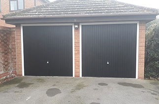 Two Garador steel range up and over garage doors in the Carlton style. In Black with White steel frames and Chrome effect handle. Fitted in Binfield. Berkshire.