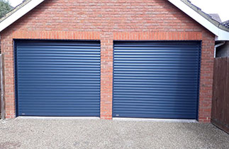 Two Sws Seceuroglide Excel roller shutter garage doors. In Anthracite Grey with matching guides and matching full boxes. Fitted in Fleet. Hampshire.