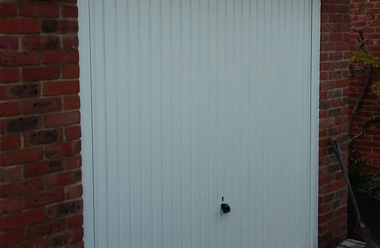 A Garador Carlton framed retractable plus garage door, complete with a steel frame and electronic operator