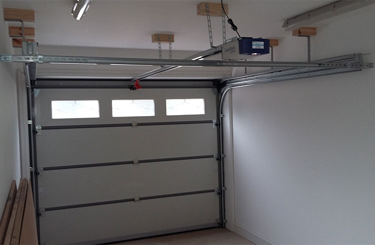 Inside view of a sectional garage door fitted with a belt driven electronic operator