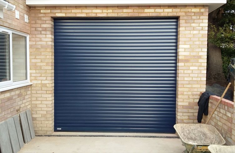 A Gliderol insulated electronically operated Navy Blue roller shutter garage door