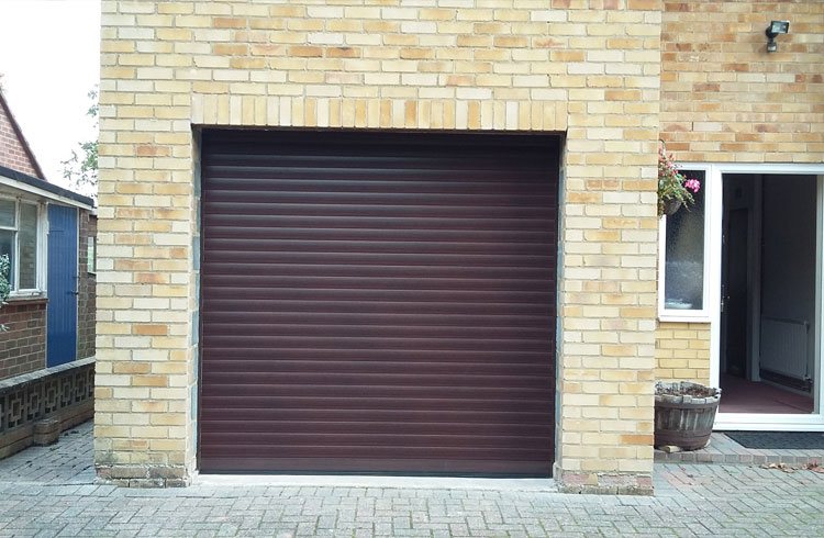 A Seceuroglide Mahogany roller shutter garage door