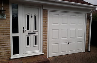 A Garador Georgian style white up and over garage door. Fitted in Blackwater. Surrey