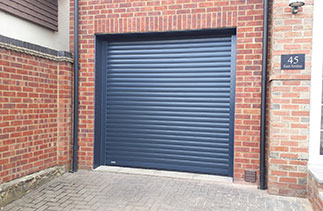 A Sws Seceuroglide Excel Anthracite Grey roller shutter garage door. Fitted in Farnham, Surrey.