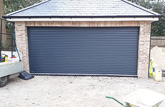 A Sws Seceuroglide Excel insulated Roller Shutter Garage Door in Anthracite Grey. Fitted in Camberley, Surrey.