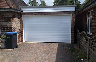 A Sws Seceuroglide Excel roller shutter garage door in White. Fitted in Egham. Surrey