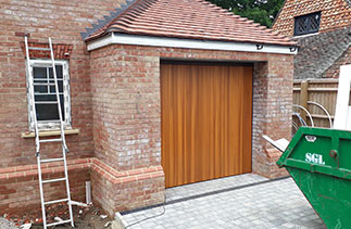 A Woodriet timber Tingwick style up and over garage door. Fitted near Horsham. Surrey.