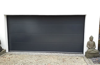 A Carteck Solid rib style garage door in Anthracite fitted in Camberley, Surrey.