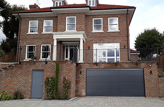 A Carteck Solid rib sectional garage door in Anthracite Grey. Fitted in Guildford, Surrey.