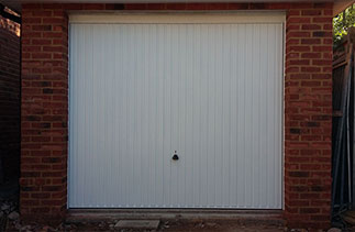 A Garador Carlton framed retractable plus door with steel frame. Fitting behind the opening