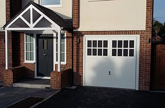 A  3 crown GRP Sherwood in white wood grain with stippled glazing and a Chrome handle complete with a white steel frame.