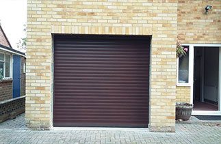 A Seceuroglide Mahogany roller shutter garage door