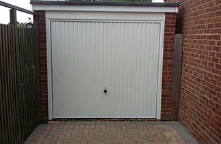 A Garador Carlton framed canopy garage door. Fitted in Mytchett, Surrey. We had excellent service from Right Choice when we wanted to replace our old garage door. We had already obtained a price over the phone from another installer but when i contacted Right Choice, Ben offered to come straight away to give his advice and price. The price was competitive and we were told the works could commence within about 2 weeks. We ordered the door and when it arrived early Ben asked if we could have it installed earlier than planned. Ben and his team arrived and within no time the old door had been removed  and the new door fitted. They were polite, clean and tidy installers and Ben certainly pays a lot of attention to detail. Excellent installation and we recommend them highly. Alan Spooner.