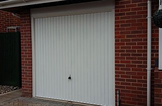 Garador Carlton up and over retractable plus door fitted with a white Ral timber frame and a white upvc fascia. Fitted in Sandhurst Berkshire.