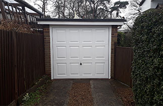 A Garador Georgian white up and over garage door. Fitted in Ashvale, Hampshire.